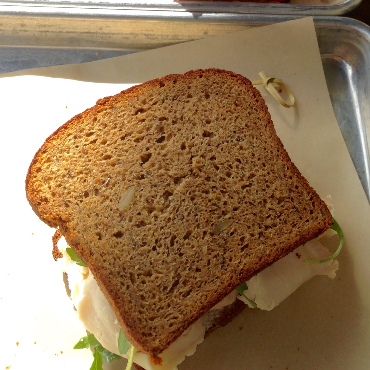 Turkey Sandwich with cream cheese and arugula.