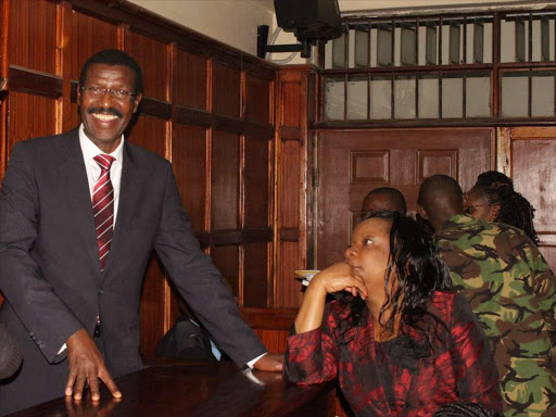 Former KPLC managing director Ben Chumo and former secretary Beatrice Meso at a Milimani court.