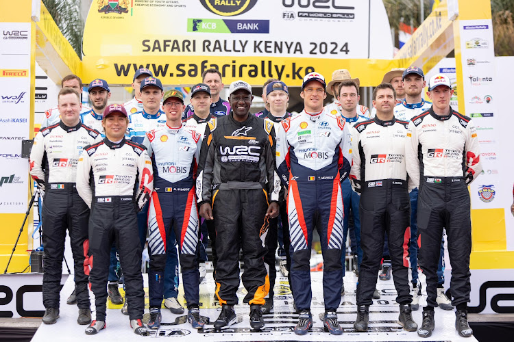 President William Ruto poses for a photo with the rally drivers at KICC during the flag off ceremony on March 28, 2024.