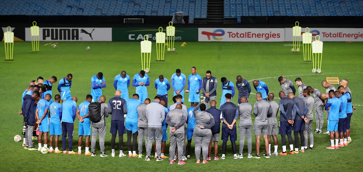 Sundowns Players pray before training at Loftus as they prepare for the CAF Champions League semifinal second leg against Esperance.