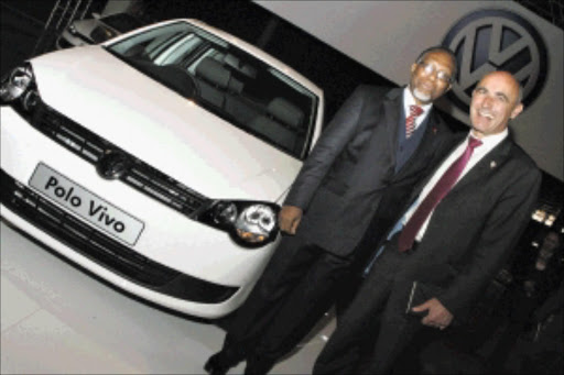 progress: Deputy President Kgalema Motlanthe and Dieter Haller, Germany's ambassador to South Africa, at the official opening of the new VWSA distribution centre yesterday. PHOTO: TSHEPO KEKANA. 17/06/2010. © Sunday World.