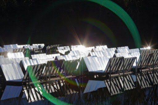 A floating photovoltaic panel system rotating automatically as it follows the sun are setup upon the surface of the lake of Colignola, a village near Pisa. File picture