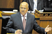 serious: 
       Finance Minister Pravin Gordhan delivering his 2013 Budget speech in Parliament on Wednesday.