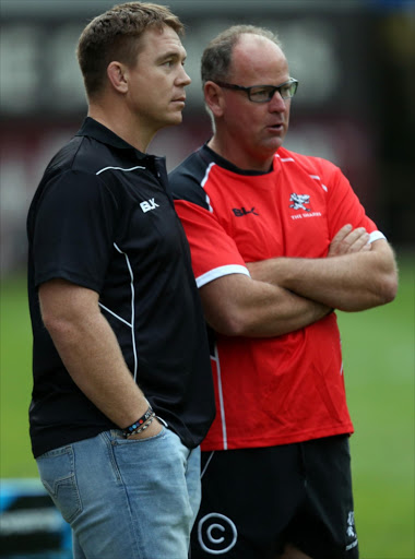 Jake White (Sharks Director of Rugby) and John Smit (Chief executive officer) of the Cell C Sharks with during the captains run at Growthpoint Kings Park on July 18, 2014 in Durban, South Africa.