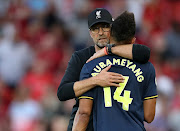 Liverpool manager Jürgen Klopp hugs Arsenal's Pierre-Emerick Aubameyang after the match.