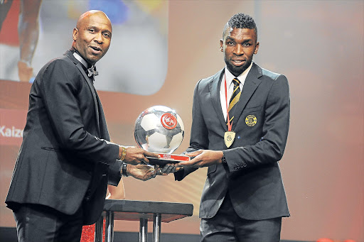 MAN OF THE MOMENT: Tefu Mashamaite, right, was the star of the show when he swept the honours at the PSL Player of the Year awards in Johannesburg at the weekend. Here he receives one of his prizes from former Bafana Bafana captain Lucas Radebe Picture: GALLO IMAGES