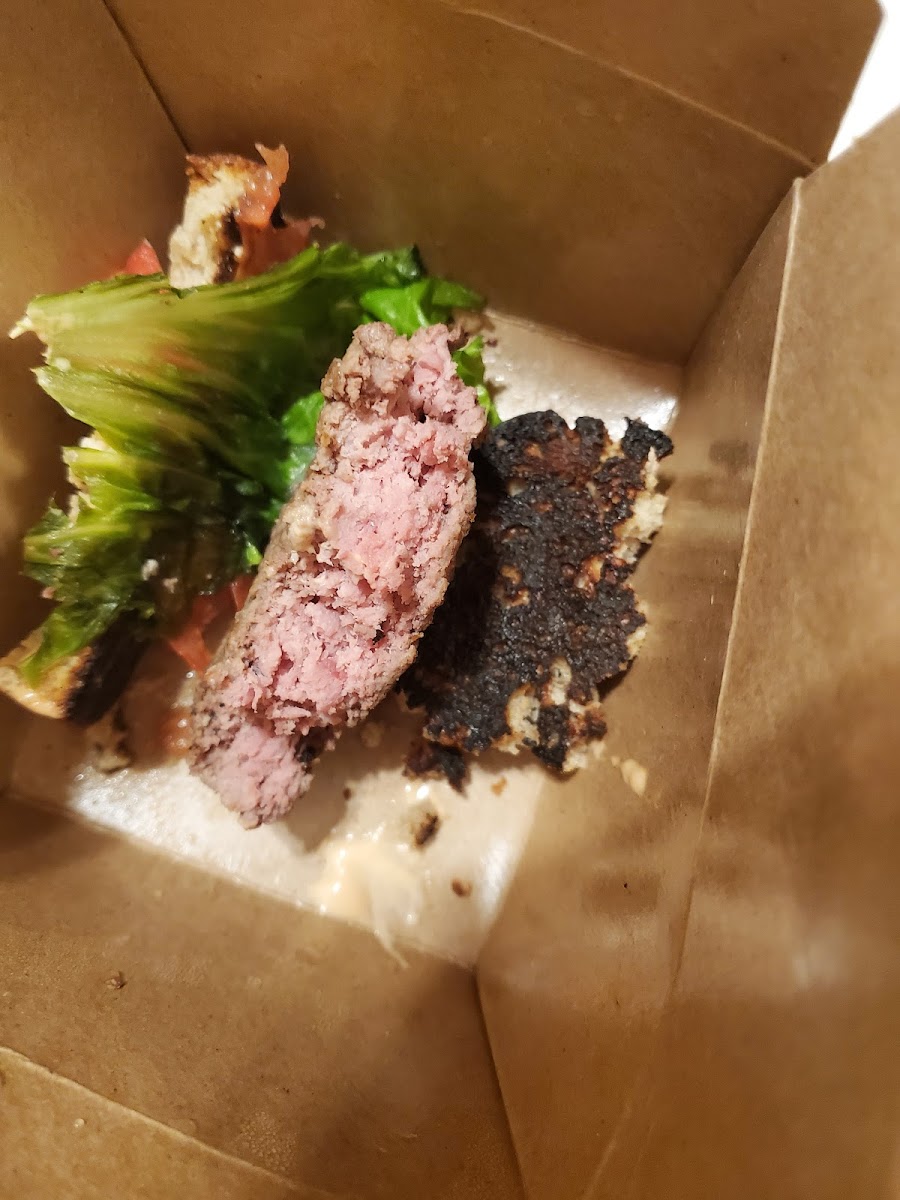 Undercooked burger and burnt bread