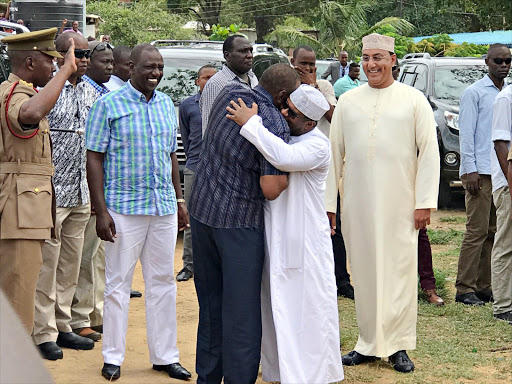 A file photo of President Uhuru Kenyatta receiving former Mombasa Senator Hassan Omar as DP William Ruto and Tourism CS Najib Balala look on at Mbaraki grounds, October 8, 2017. /ELKANA JACOB