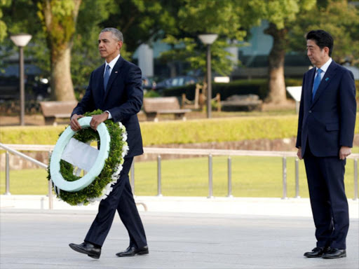 US President Barack Obama with Japanese Prime Minister Shinzo Abe on May 27 at Hiroshima Peace Memorial Park in Hiroshima, Japan. /REUTERS