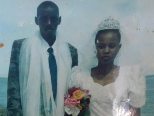 Cornelius Muike and Miriam Mueni in a photograph they took on their wedding day on March 22, 2003. Mueni accuses his husband of marrying a second wife yet they are not divorced. /KIRIMI MURIITHI