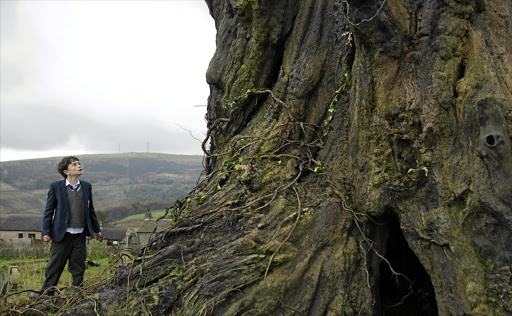 Lewis MacDougall plays Conor, who communicates with an earth spirit in an ancient tree, in 'A Monster Calls'.