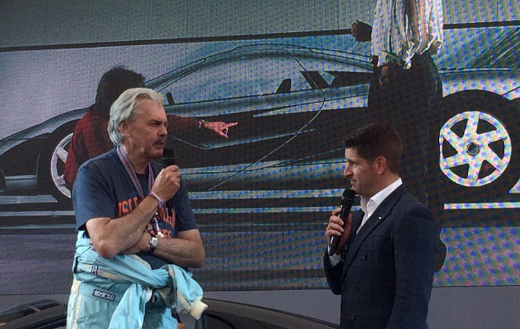 Gordon Murray, South African designer of the famous McLaren F1, speaks on the stand