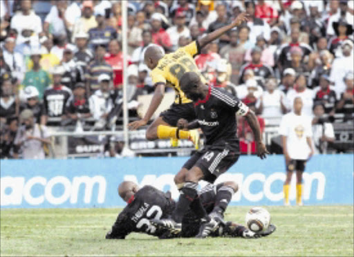 20100221VNH. Mandla Masango of Kaizer Chiefs fight for the ball with Lucas Thwala and Lucky Lekgwathi of Orlando Pirates during their Absa Premiership match at Orlando Stadium.PHOTO:VELI NHLAPO