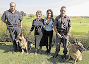 GOOD CAUSE: Warrant Officer Christo Prinsloo and his dog Killer, Dorothy Rachwaska, Loui Fish - whose linen range is named In Bed with Loui Fish - and Warrant Officer Martin Bann and his dog Milton