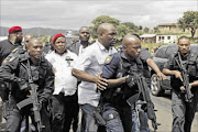 IN THE NEWS: EFF leader Julius Malema  arriving in Nkandla under heavy police guard to give a house to a needy familypHOTO: TEBOGO LETSIE