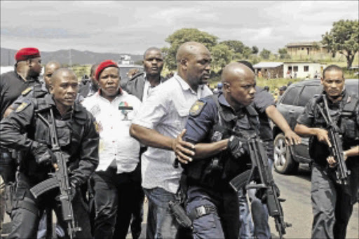 IN THE NEWS: EFF leader Julius Malema arriving in Nkandla under heavy police guard to give a house to a needy familypHOTO: TEBOGO LETSIE