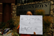 A protest was held outside Parktown Boys' High on Tuesday. On the same day, Enoch Mpianzi's parents and a SAHRC delegation visited the North West lodge where Enoch died. 