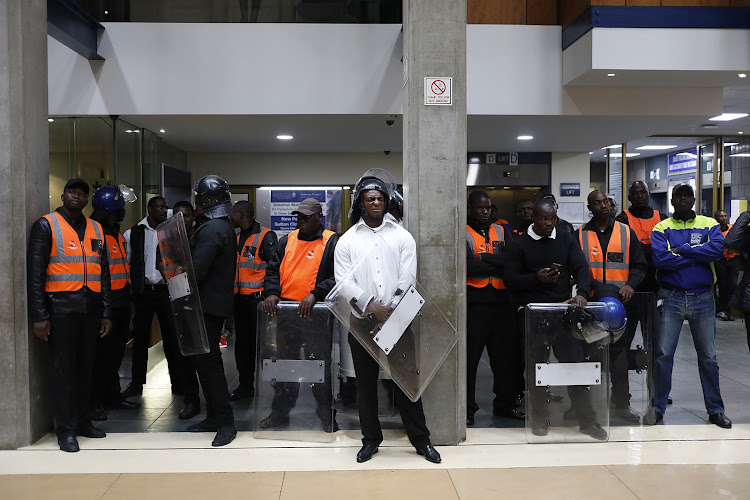 Security personnel seen at Wits University's Solomon Mahlangu house, February 6 2019. Picture: ALON SKUY
