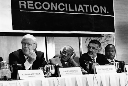 Dr. Alec Boraine, Truth and Reconciliation Commission (TRC) deputy chairperson and Archbishop Desmond Tutu (Chairperson) at a TRC hearing on 11 November 1997.