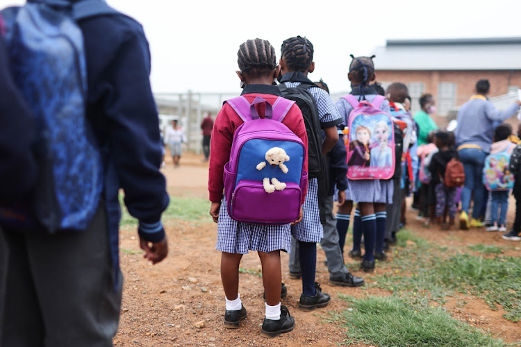 Grade one learners line up before being led into class for the first time, 12 January 2022, at Setlabotjha Primary School in Sebokeng, Southern Gauteng.
