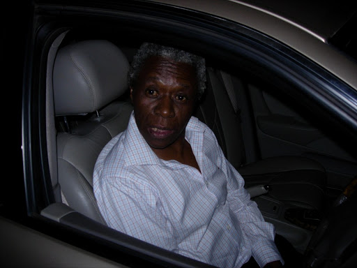 Judge Nkolo John Motata in his luxury Jaguar at the scene of the accident where he crashed through a wall. 06/01/2007. Picture Credit. Business Day