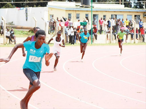 Girls take part in the 400m at Kipchoge Stadium on Wednesday. /STANLEY MAGUT