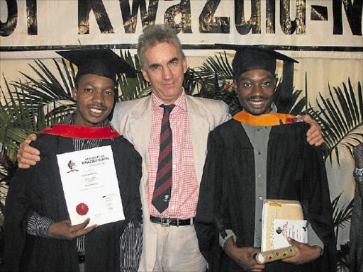 Psychology Maziwisa with Peter Roebuck at a graduation ceremony