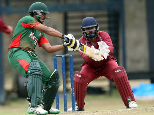 R Mukhi of Kenya bats against Qatar wicket keeper Mohammed Rezlan during their T-20 Cricket match at the Nairobi Gymkhana grounds yesterday. /PIC-CENTRE