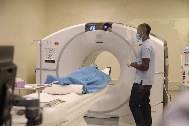 A patient lies on a PET/ CT scanner for cancer screening at the Kenyatta University Teaching, Referral & Research Hospital.