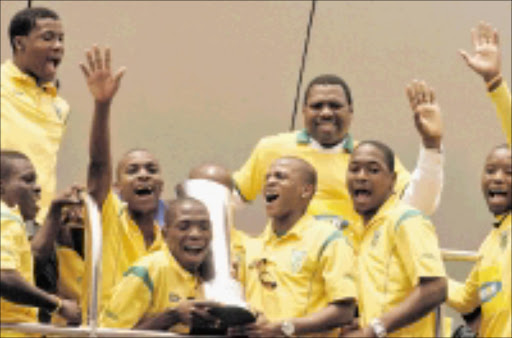 WINNERS: Lamontville Golden Arrows players were joined by premier Zweli Mkhize during their celebrations in Durban yesterday. Pic. Siyabonga Mosunkutu. 02/11/2009. © Sowetan.
