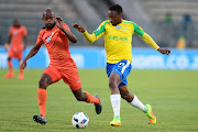 Sibusiso Mbonani of Polokwane City tackles Sibusiso Vilakazi of Mamelodi Sundowns during the 2016 Telkom Knockout, Last 16 match between Mamelodi Sundowns and Polokwane City at Lucas Moripe Stadium on October 27, 2016 in Pretoria, South Africa.