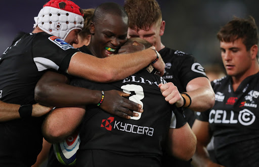 Tera Mtembu (c) with Lourens Adriaanse of the Cell C Sharks after his try during the Super Rugby match between Cell C Sharks and Southern Kings at Growthpoint Kings Park on March 18, 2017 in Durban, South Africa.