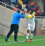 Mamelodi Sundowns forward Lebohang Maboe is congratulated by his coach Pitso Mosimane after scoring on debut against Polokwane City during an Absa Premiership match on August 7, 2018 at Peter Mokaba Stadium in Polokwane.  