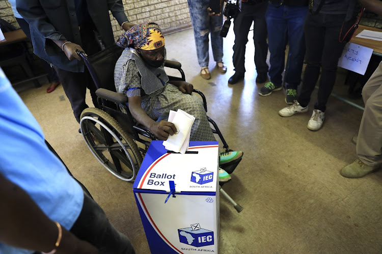 A disabled woman casts her vote in Alexandra, Johannesburg. file photo.