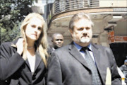 APPEARANCE: The ex-fiancee of Glen Agliotti, Dianne Muller, and her boyfriend entering the side entrance of the Johannesburg high court. Pic. Lucky Mofokeng. 05/11/2009. © Sowetan.