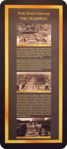 You are walking through the Teamway, now a pedestrian passageway running along the west side of the York Street "subway" or tunnel and underneath the railway viaduct. In earlier days, goods...