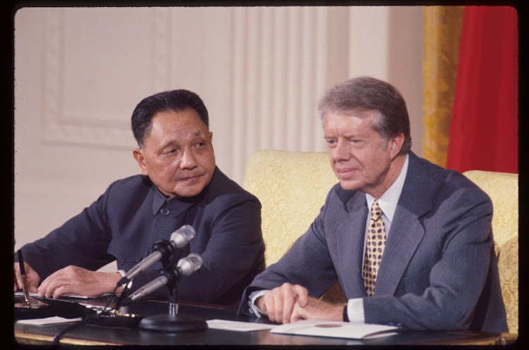 Chinese premier Deng Xiaoping, left, and US president Jimmy Carter sit at a press conference in Washington, DC, US, in this January 31 1979 file photo. Picture: GETTY IMAGES/DIRCK HALSTEAD