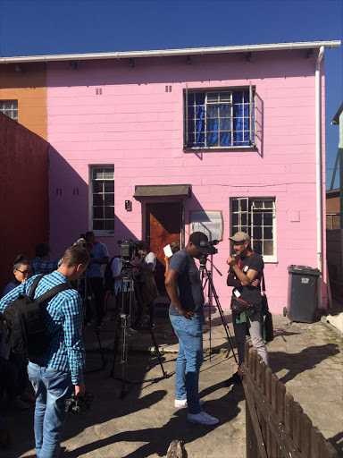 Journalists gather in front of the Pieters' home ahead of President Jacob Zuma's visit.