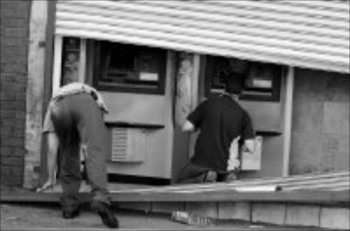ALMOST BLASTED: The two ATMs that were nearly bombed at Zola in Soweto. Pic. Peter Mogaki. 15/05/08. © Sowetan.