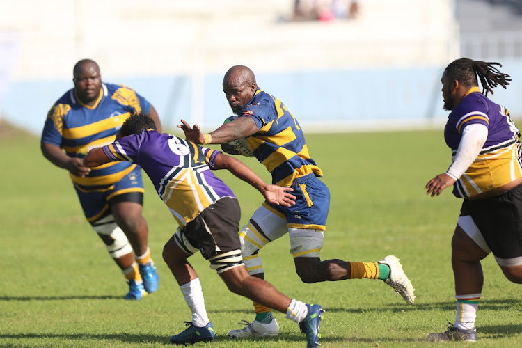 Police's No 7 Bongani Ngqolombe takes on the Kruisfontein defence at the Sisa Dukashe Stadium in Mdantsane. Police have consistently shown their determination and commitment in wanting to win the Super League for the third consecutive year.