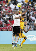 Collins Mbesuma (who scored the opening goal for Pirates) and Tefu Mashamaite compete during the Soweto derby between Orlando Pirates and Kaizer Chiefs, played before a capacity crowd at FNB Stadium yesterday. The final score was 1-1. The match was broadcast to 19 countries, including Latin America, the US, Australia and New Zealand, making the global feed the biggest for a domestic event See Sport Picture: SIMPHIWE NKWALI