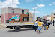 Protesters greet new arrivals at Forest Village in September 2019 by objecting to the allocation of homes there.