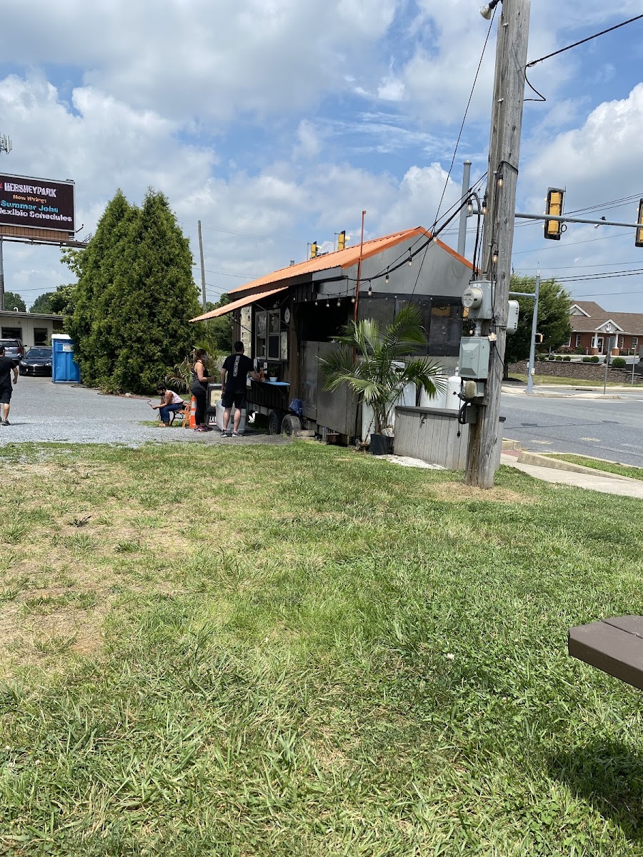 Fun place to eat; they have tables and benches outside in the grass with music, lights.