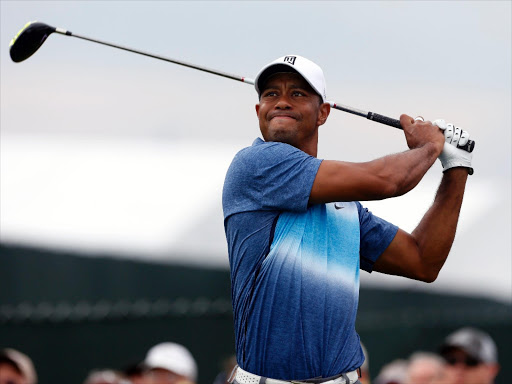 Tiger Woods hits his tee shot on the 11th hole during the first round of the 2015 PGA Championship golf tournament at Whistling Straits in Sheboygan, Wisconsin, in this file photo taken August 13, 2015. Photo/REUTERS