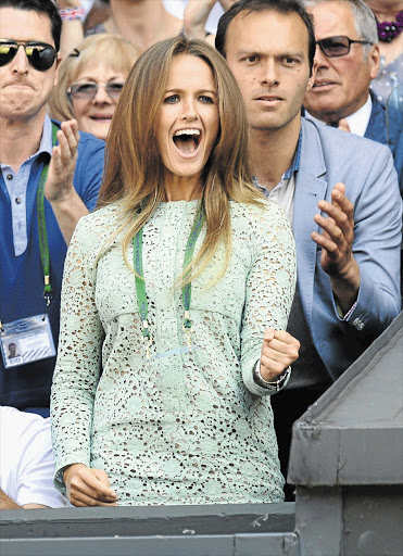 Kim Sears cheered boyfriend Andy Murray on as he beat Novak Djokovic to win the Wimbledon men's singles final on Sunday