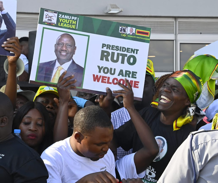 Residents of Zimbabwe welcomes President William Ruto with a placard on April 26, 2024.