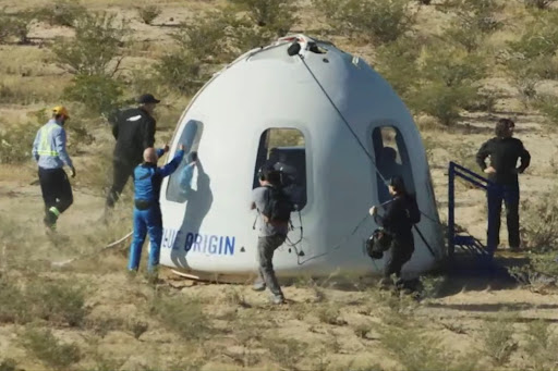 Billionaire Jeff Bezos gives a thumbs up outside the capsule of Blue Origin's New Shepard mission NS-18, which carried actor William Shatner and 3 other passengers on a suborbital flight, near Van Horn, Texas, the US, on October 13 2021.