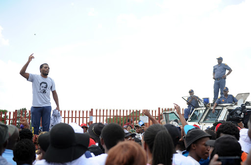 Student activist and former Wits University SRC president Mcebo Dlamini addresses students after his release outside the Palm Ridge Court .