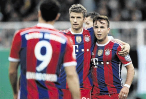 BEHIND: Bayern Munich's Mario Goetze, right, Thomas Mueller, centre, and Robert Lewandowski will have to play catch-up this seasonPHOTO: JONAS GUETTLER/EPA