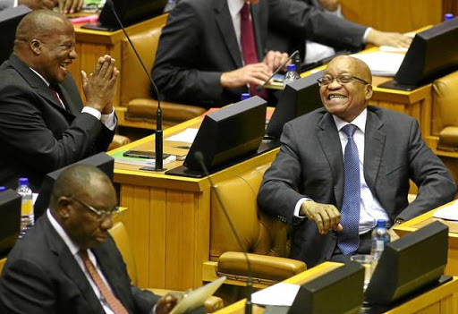 HEH, HEH, HEH: President Jacob Zuma shares a joke with ANC chief whip Jackson Mthembu in the National Assembly during his budget vote speech.